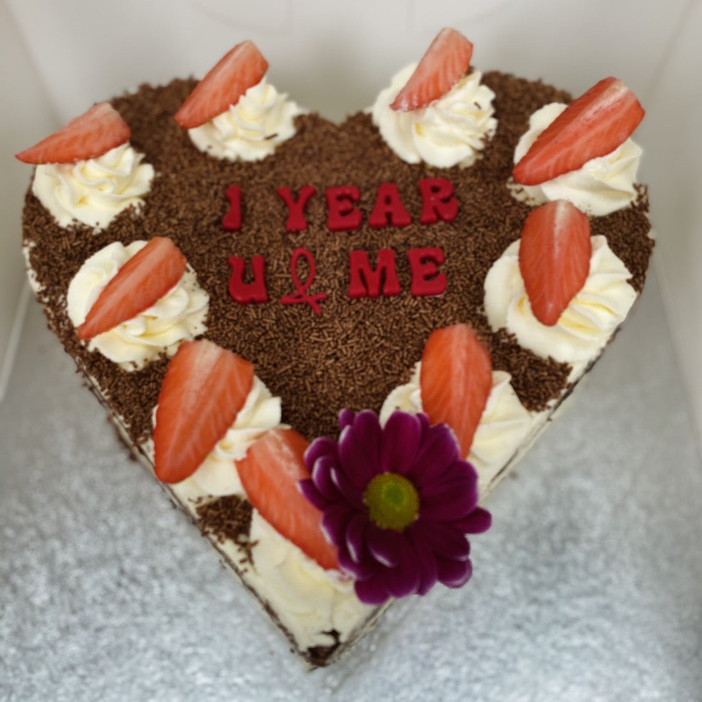Image of the Yasmin Bakery & Catering heart shaped Black Forest cake Several layers of chocolate sponge cake sandwiched with whipped cream and cherries